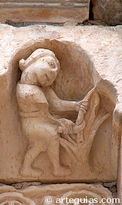 Hombre medieval podando una vi&ntilde;a