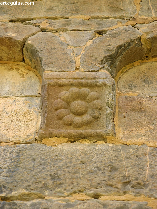 M&eacute;nsula con una flor de la cabecera